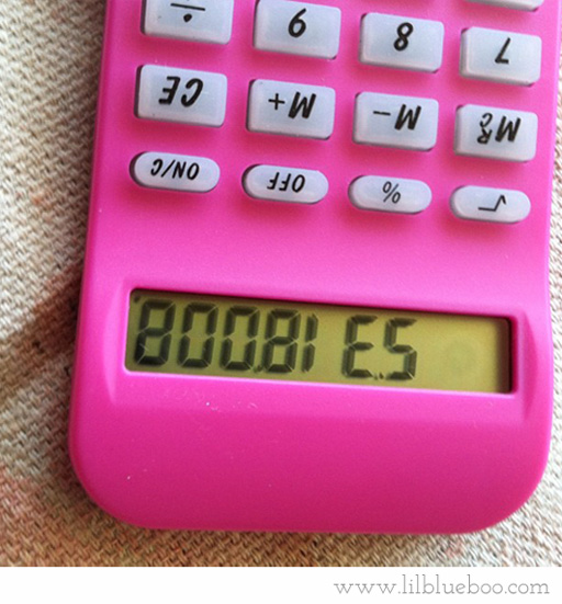 a man holds up a calculator upside down, with the words boobies